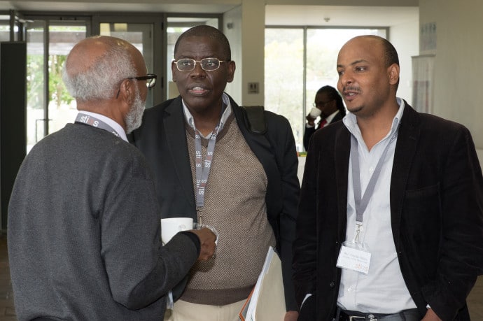 Prof Berhanu Abegaz (left) in conversation with Prof Rotimi Suberu en Prof Yonatan Fessha (right)
